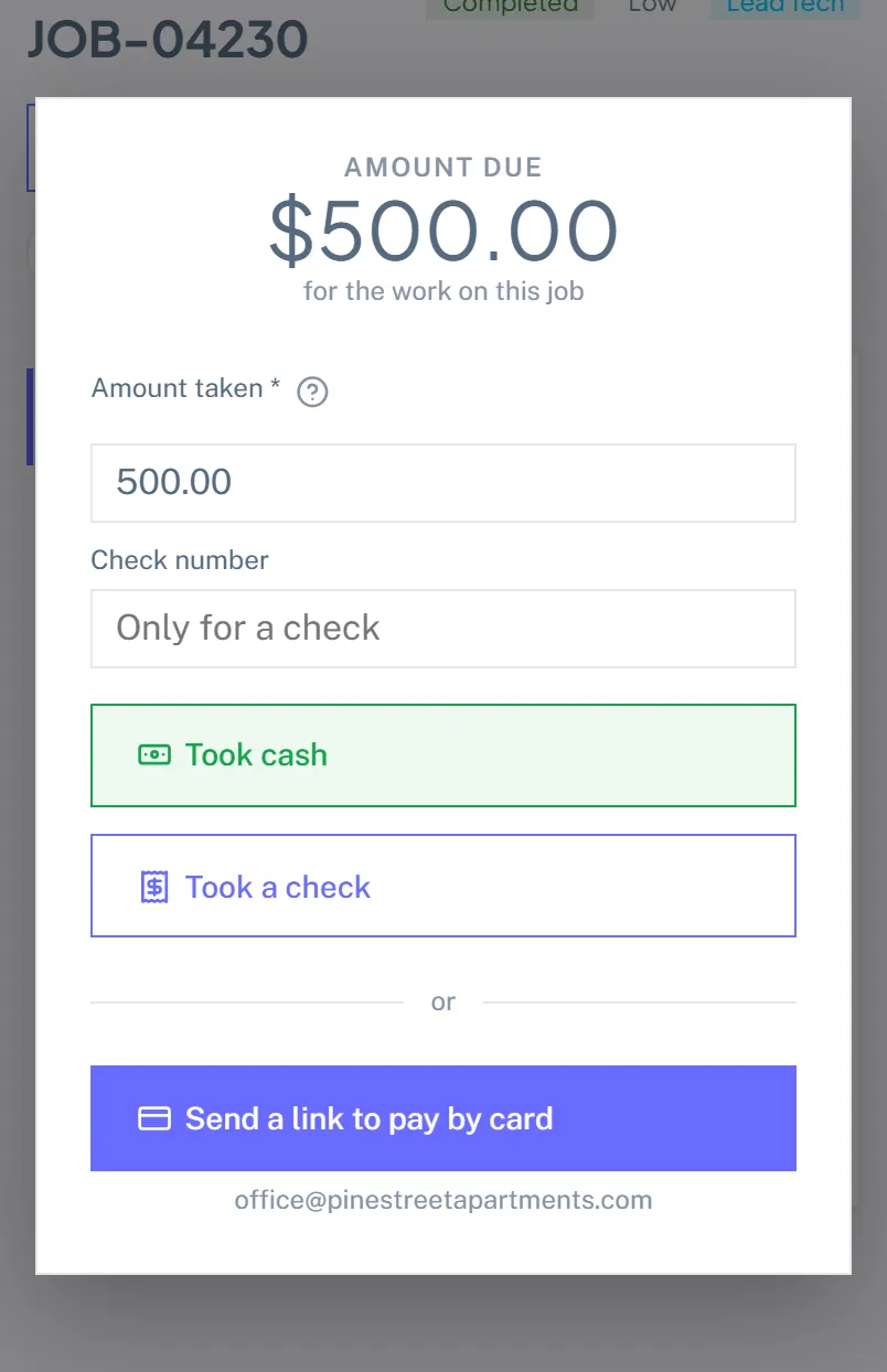 The collect payment panel on a phone showing the amount due, an editable amount taken, a check number field, Took cash and Took a check buttons, and a card link button